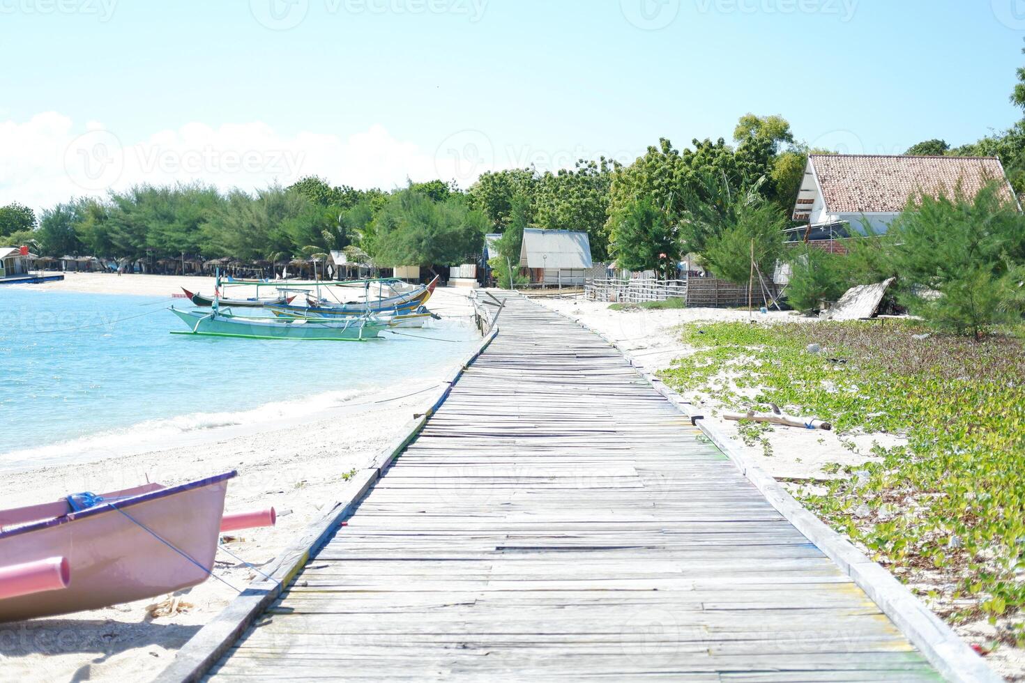 wooden boardwalk a pristine sandy beach photo