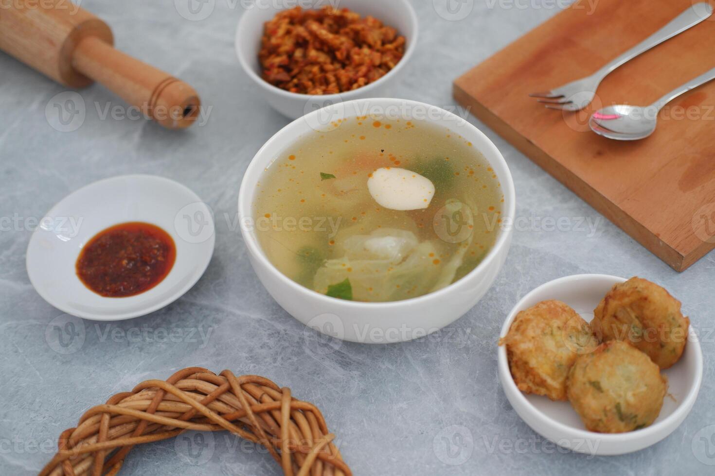 traditional Indonesian meal arranged neatly on a marble background photo