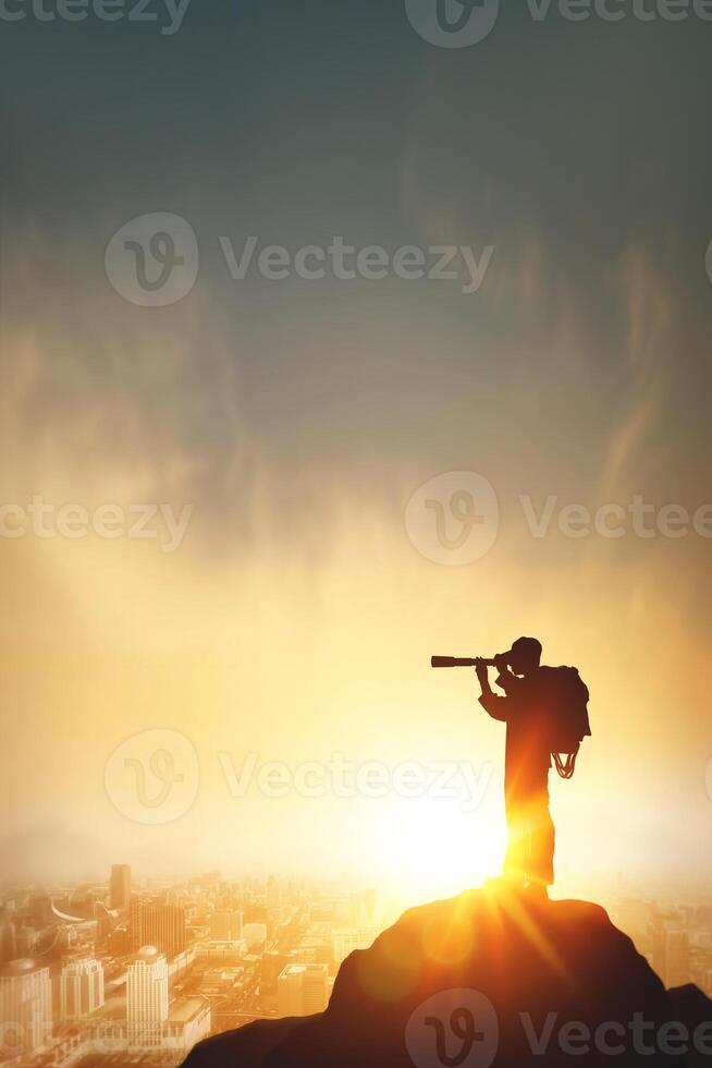 Vision for success ideas. Businessman perspective for future planning. Silhouette of man holding binoculars on mountain peak against bright sunlight sky with business city background, vertical photo