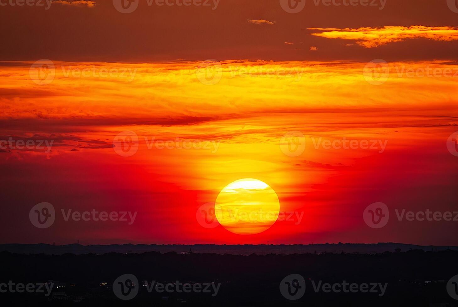 Fiery Sunset with Vivid Orange and Red Sky photo