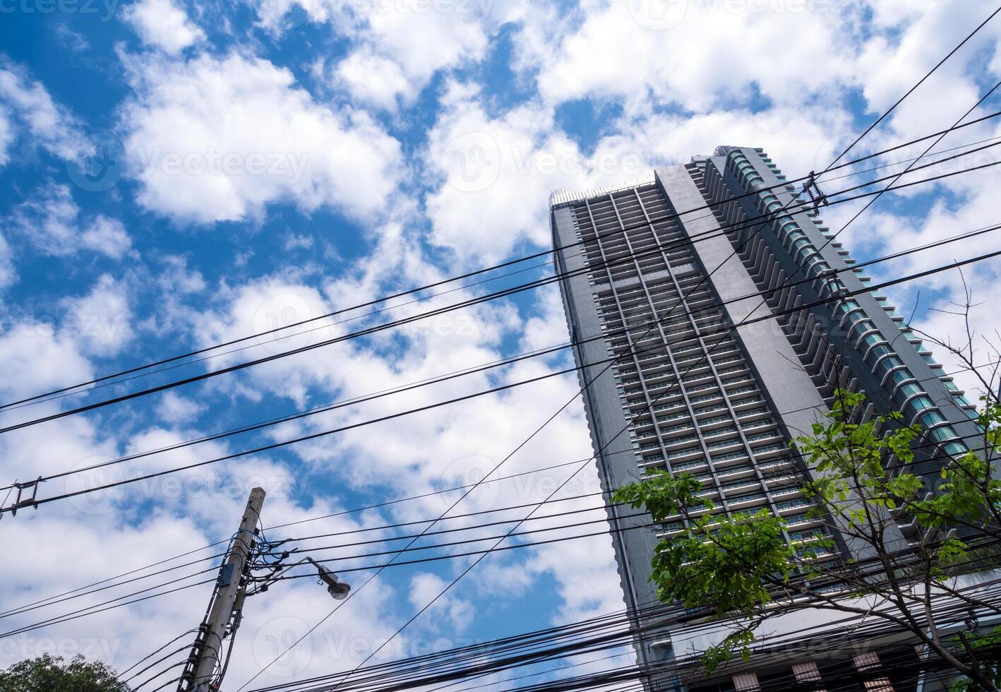 High-rise building and the intricate across power line photo