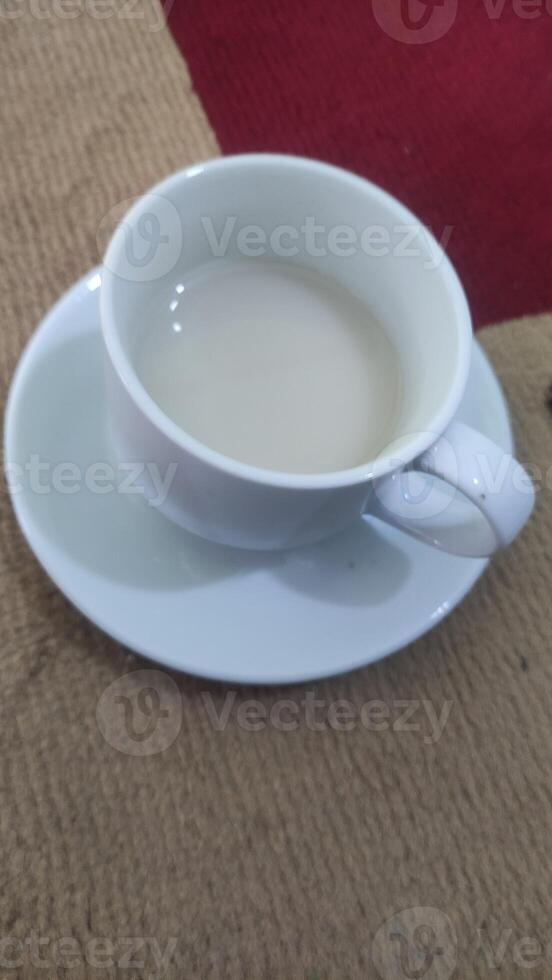 a glass of fresh cow's milk in the morning photo
