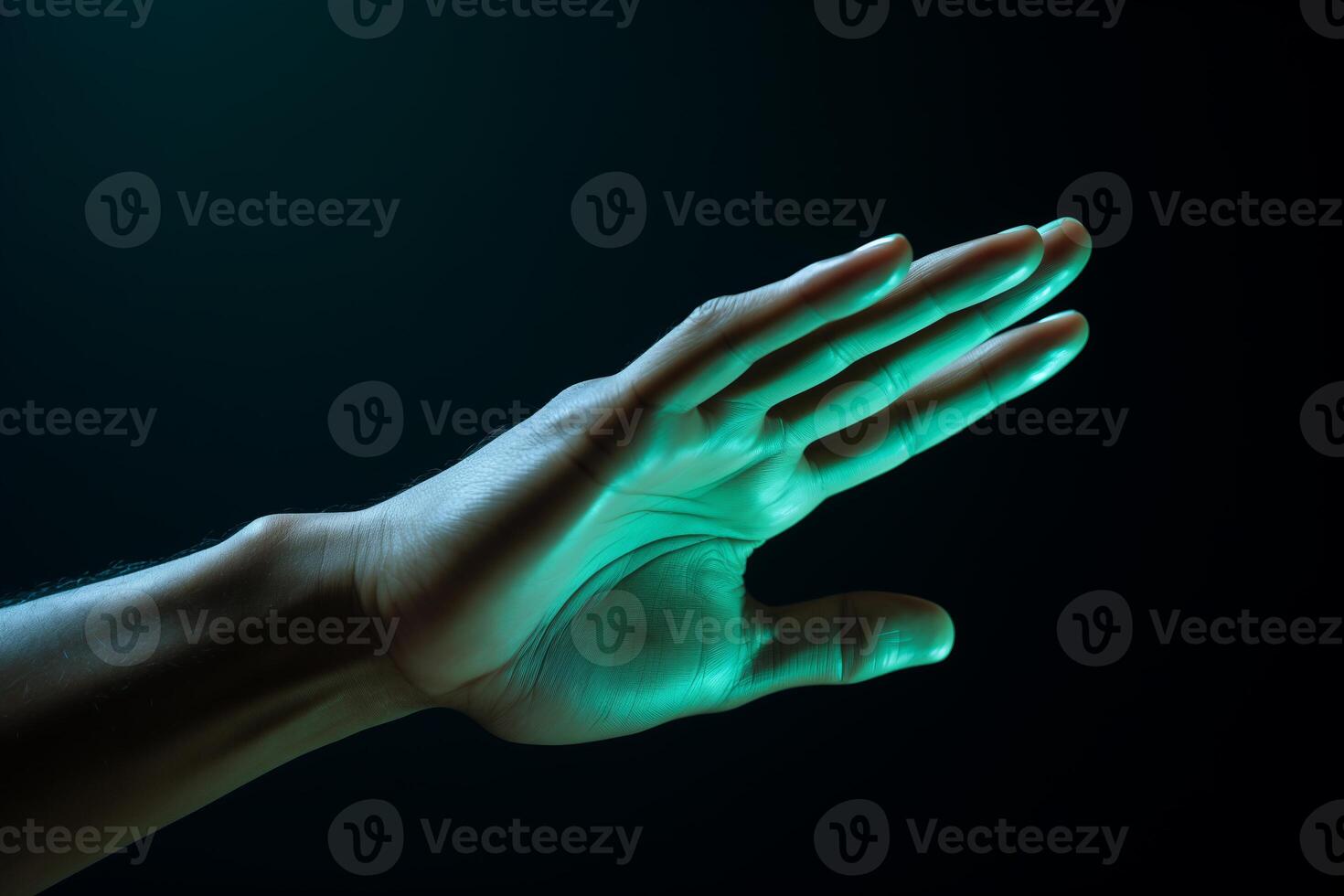 A persons hand holding a brightly glowing object in the dark, illuminating the surroundings with a mysterious light. photo