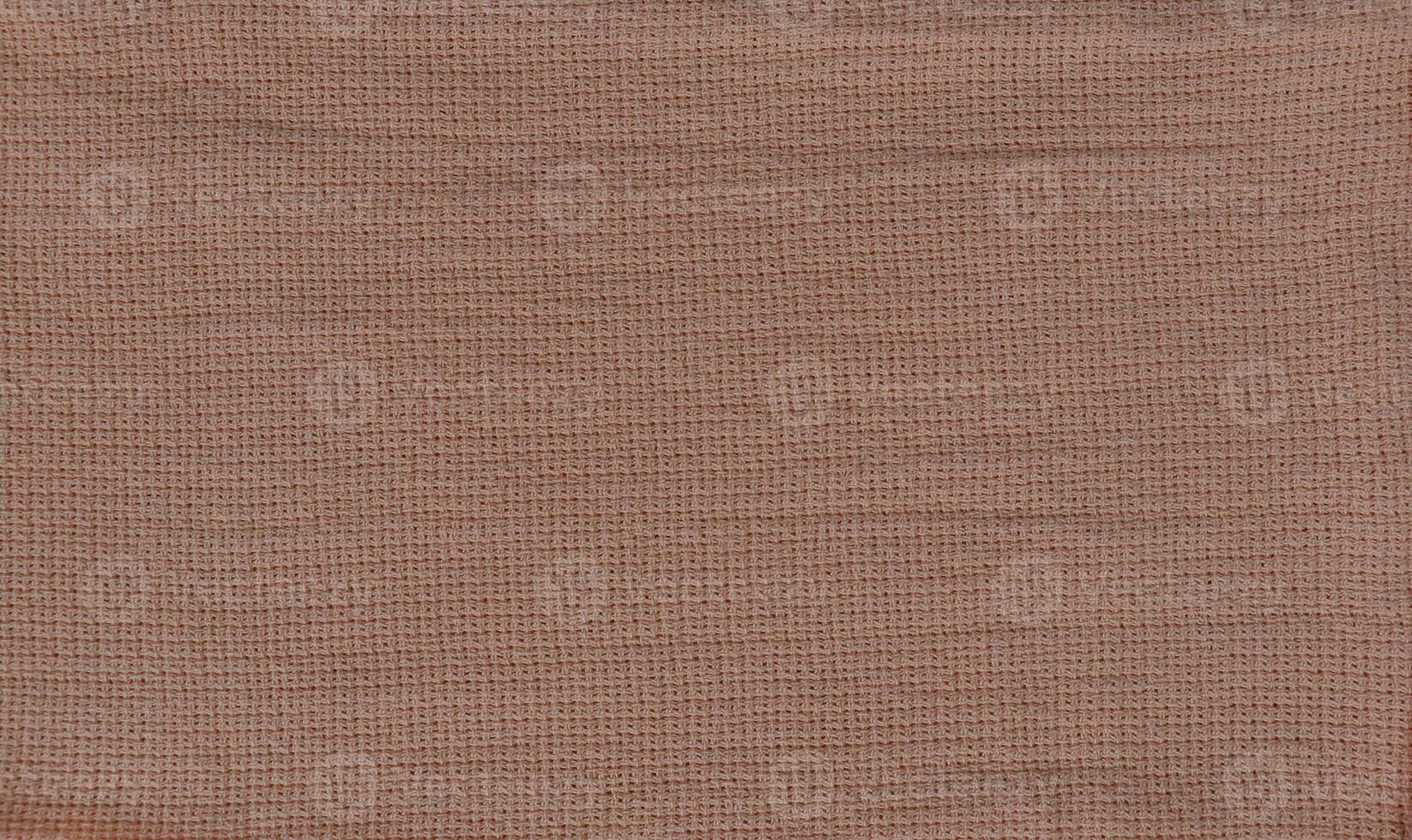 Hemp fabric with large stitching and rose gold color photo
