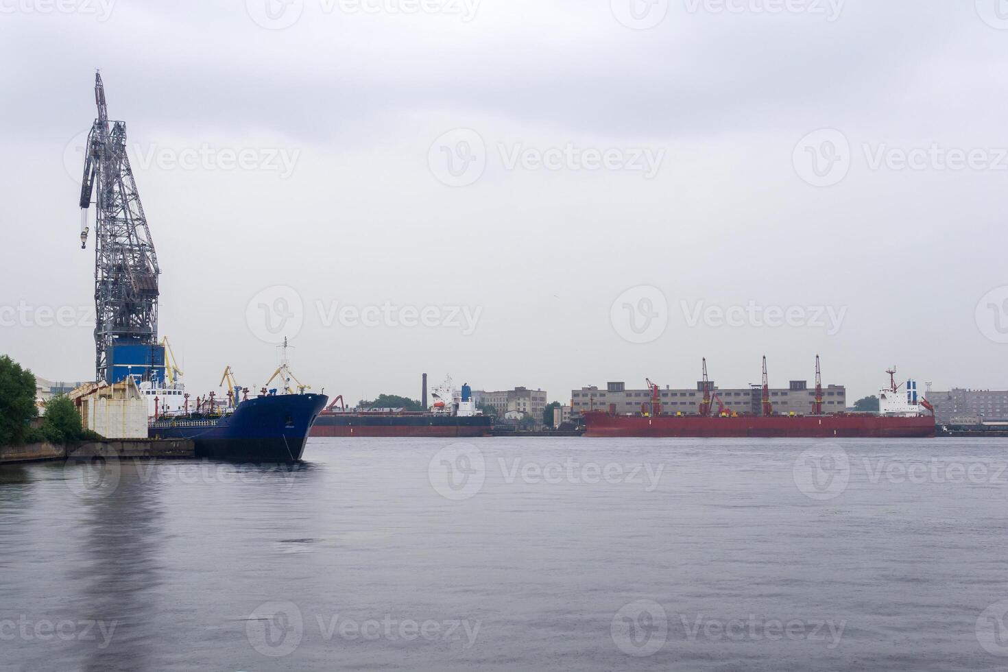 ships in a cargo port on a cloudy day photo