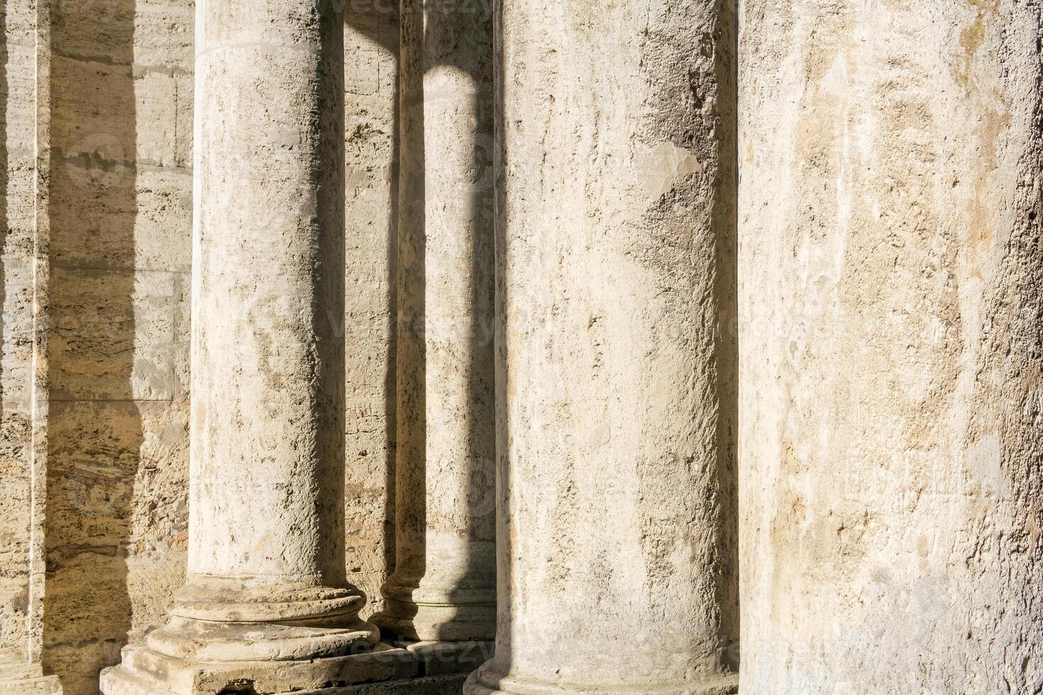 abstract architectural background - columns and walls made of light stone photo