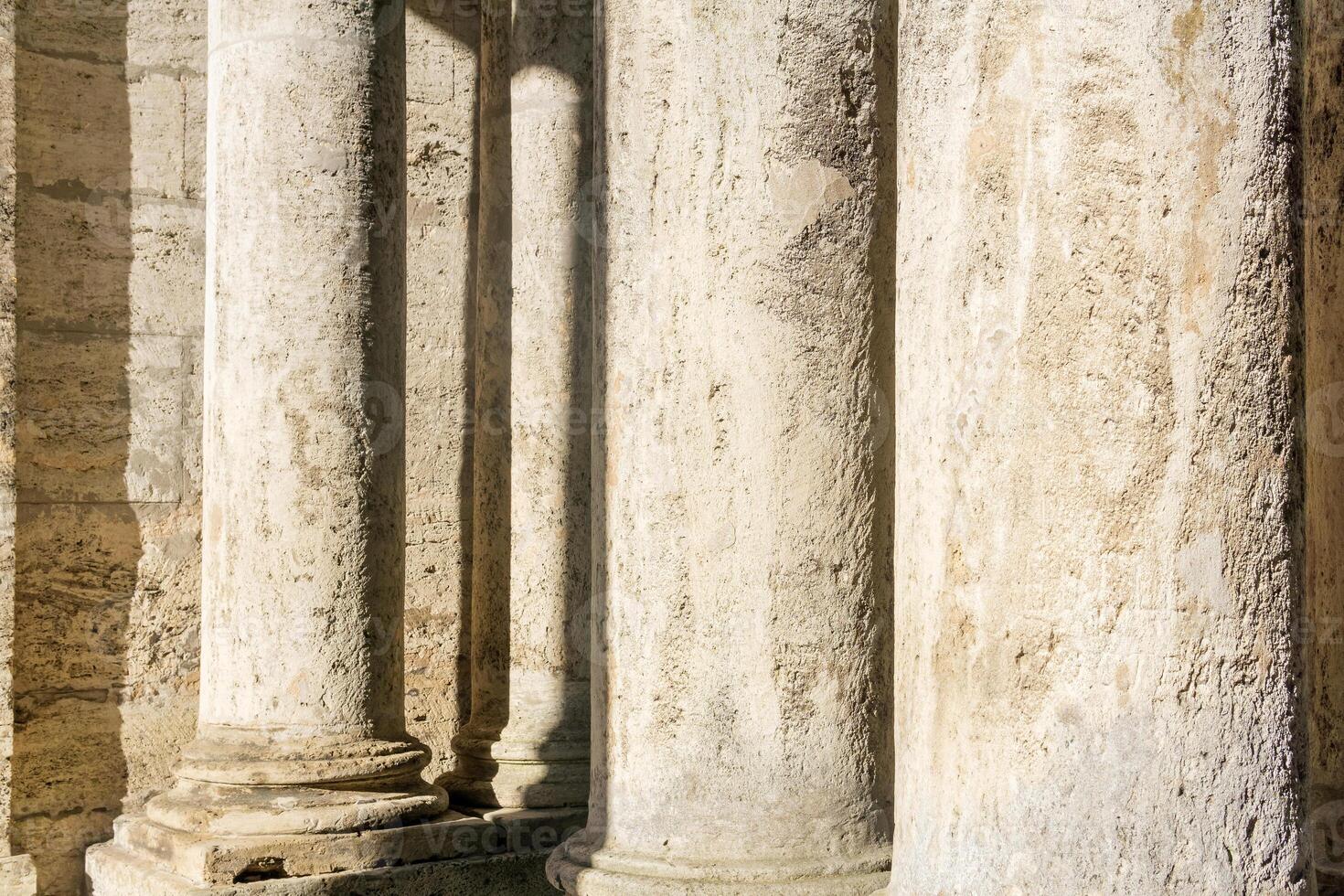 abstract architectural background - columns and walls made of light stone photo