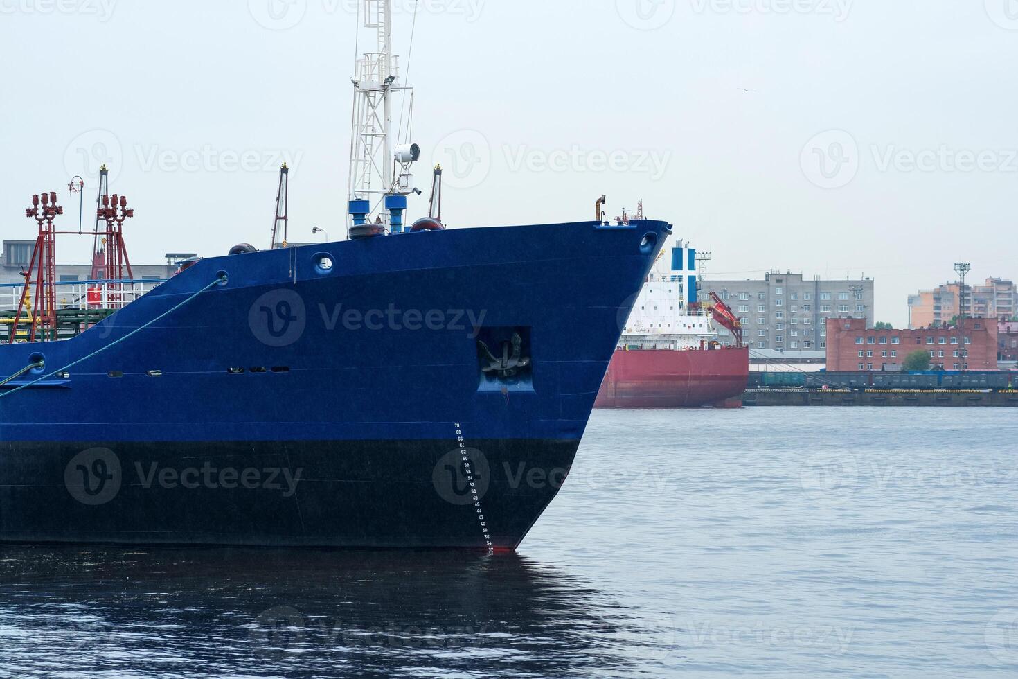 ships in a cargo port on a cloudy day photo