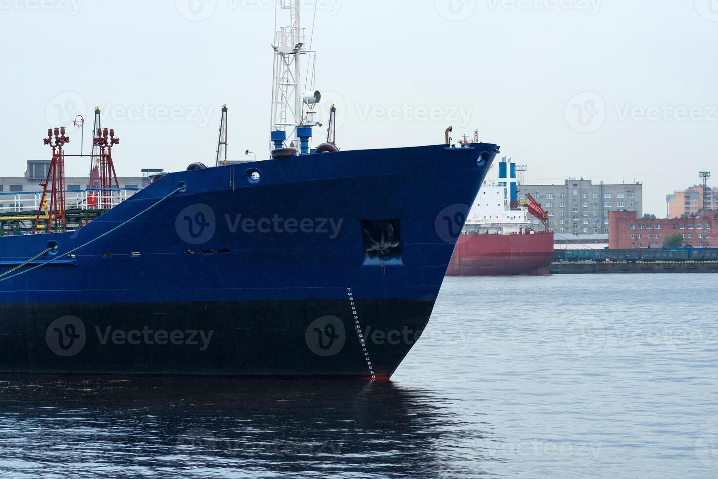 ships in a cargo port on a cloudy day photo