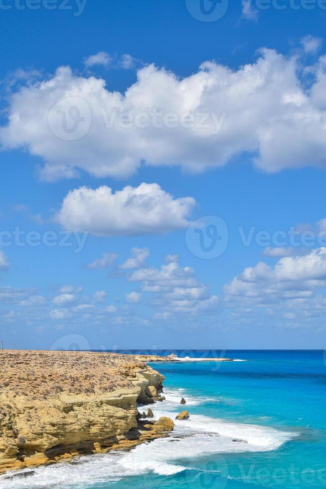 the view of agebah beach and rock cliffs in marsa matrouh Egypt during daytime photo