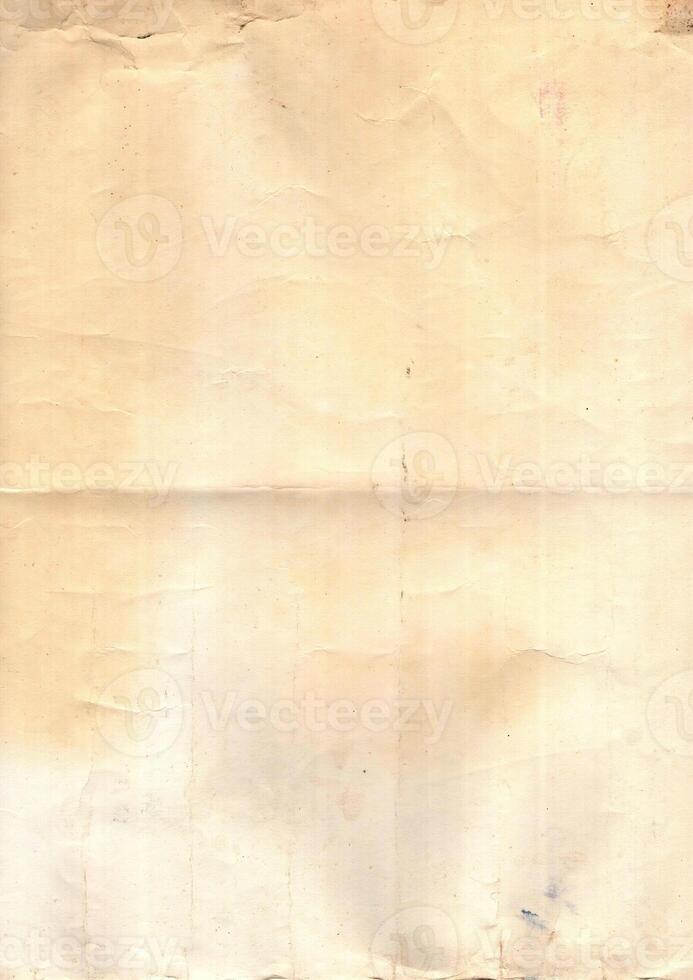 Interesting texture of old paper, soiled and damaged, as well as darkened by time and use, on a white background. Unique vintage texture of old paper which is approximately 60-70 years old. photo