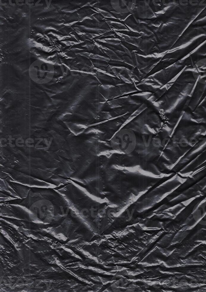 black plastic bag texture, wrap texture on a black background wallpaper, wrinkled plastic pattern for creative and decorative design photo