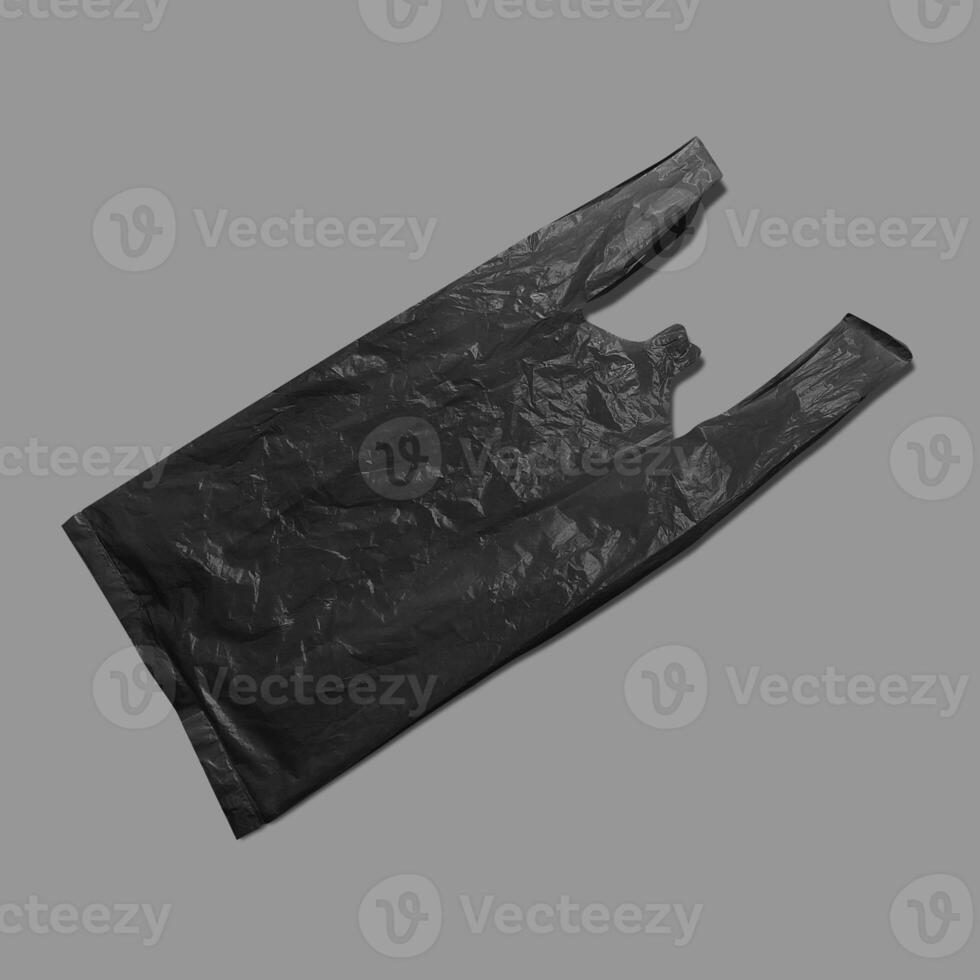 Black plastic bag isolated on white background photo