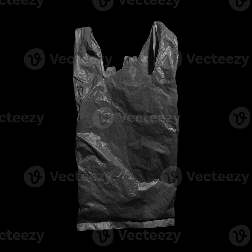 Black plastic bag isolated on white background photo
