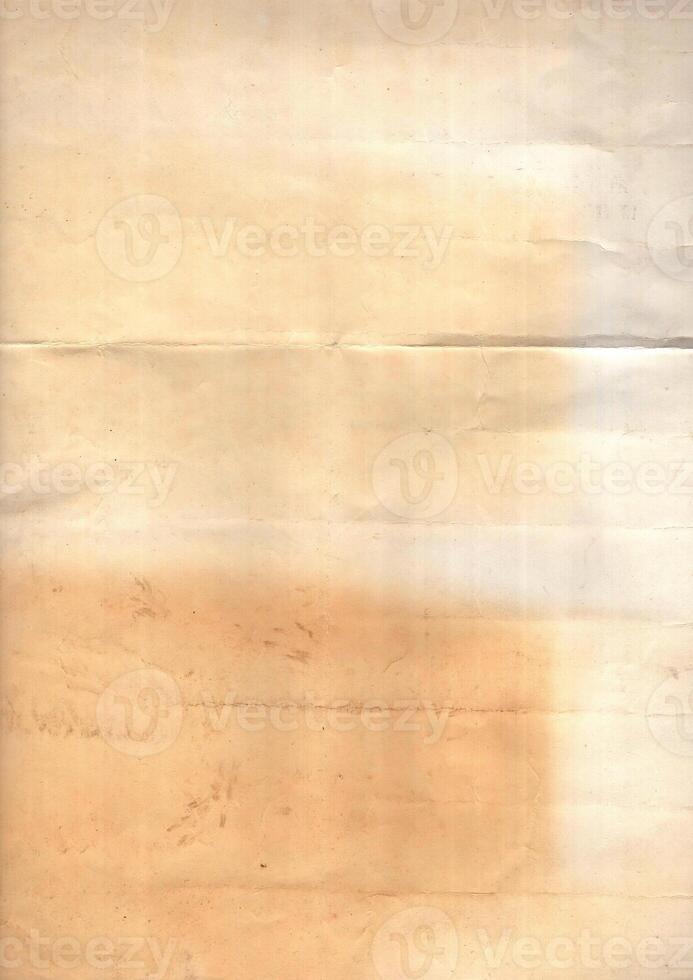 Interesting texture of old paper, soiled and damaged, as well as darkened by time and use, on a white background. Unique vintage texture of old paper which is approximately 60-70 years old. photo