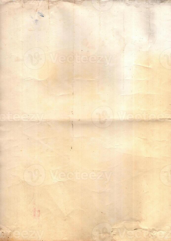 Interesting texture of old paper, soiled and damaged, as well as darkened by time and use, on a white background. Unique vintage texture of old paper which is approximately 60-70 years old. photo