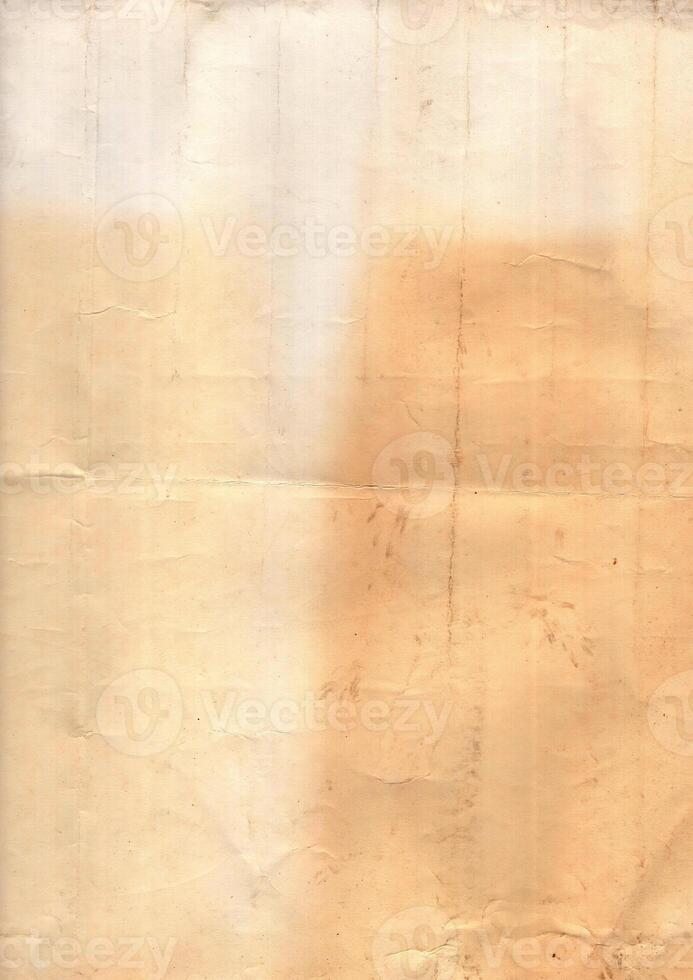 Interesting texture of old paper, soiled and damaged, as well as darkened by time and use, on a white background. Unique vintage texture of old paper which is approximately 60-70 years old. photo