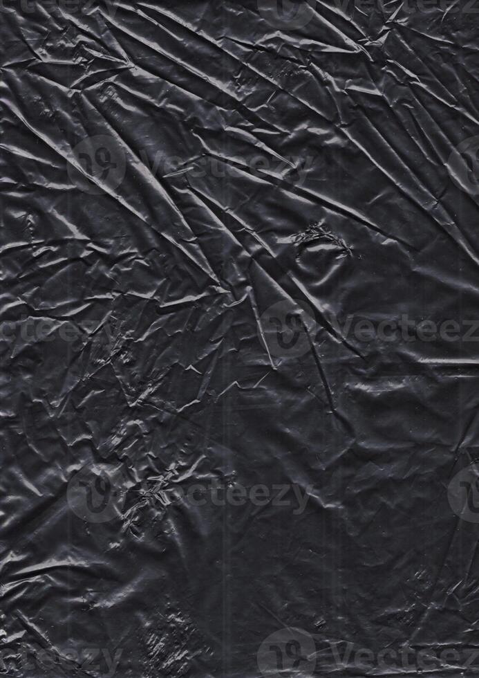 black plastic bag texture, wrap texture on a black background wallpaper, wrinkled plastic pattern for creative and decorative design photo