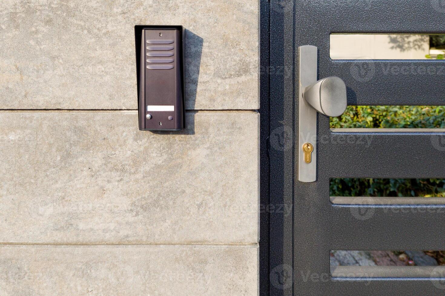 Metal gate with security intercom system photo