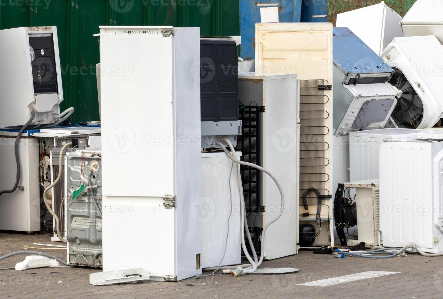 Old refrigerators and washing machines for e-waste disposal photo