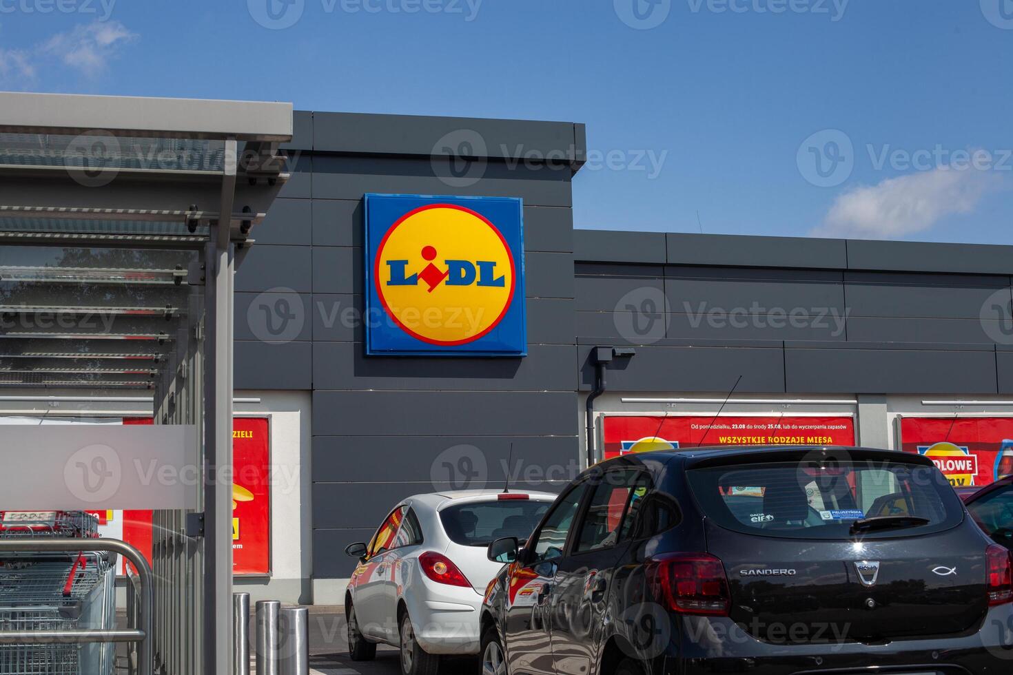 Skorzewo, Poland. 21 August, 2021. Exterior of Lidl store with parked cars photo