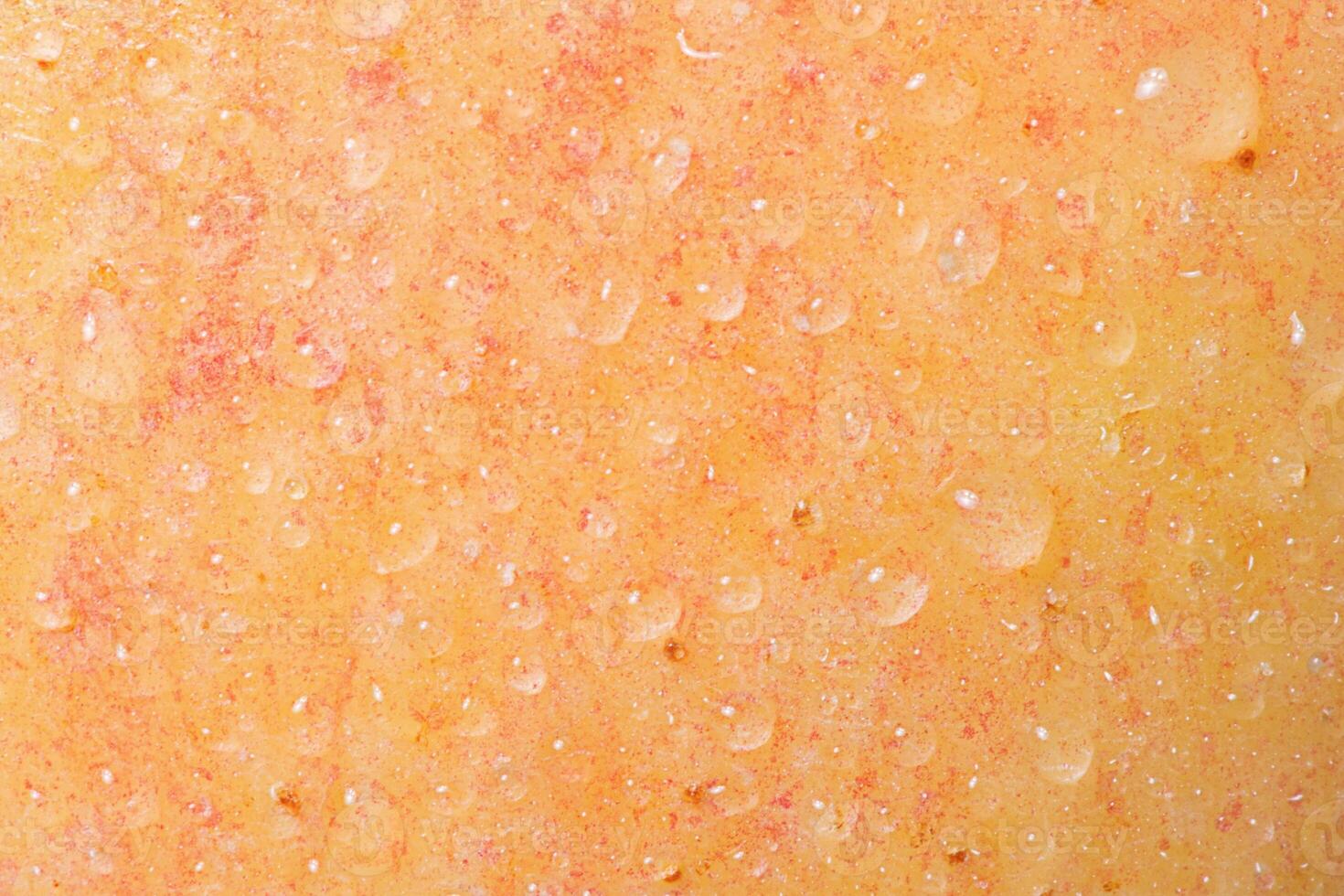 Texture of a yellow and red apple with water drops as a background. photo