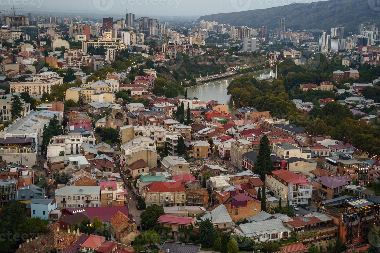 A breathtaking aerial view of Tbilisi showcasing vibrant architecture and dynamic river life photo