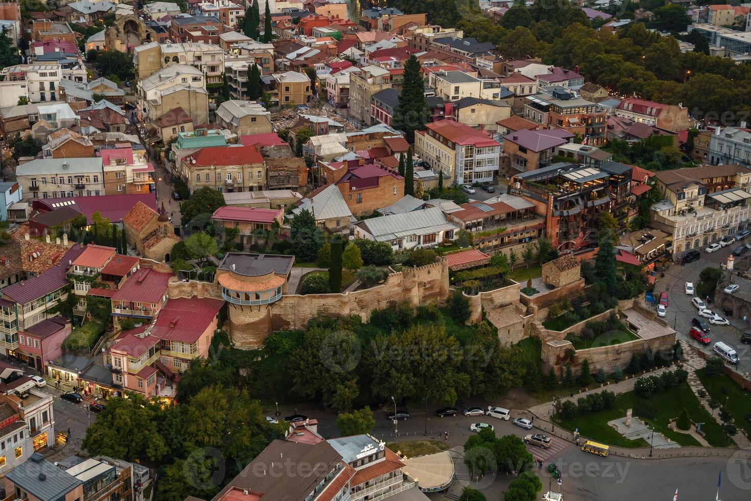 Aerial view of Tbilisis historic district with colorful rooftops and ancient fortifications photo