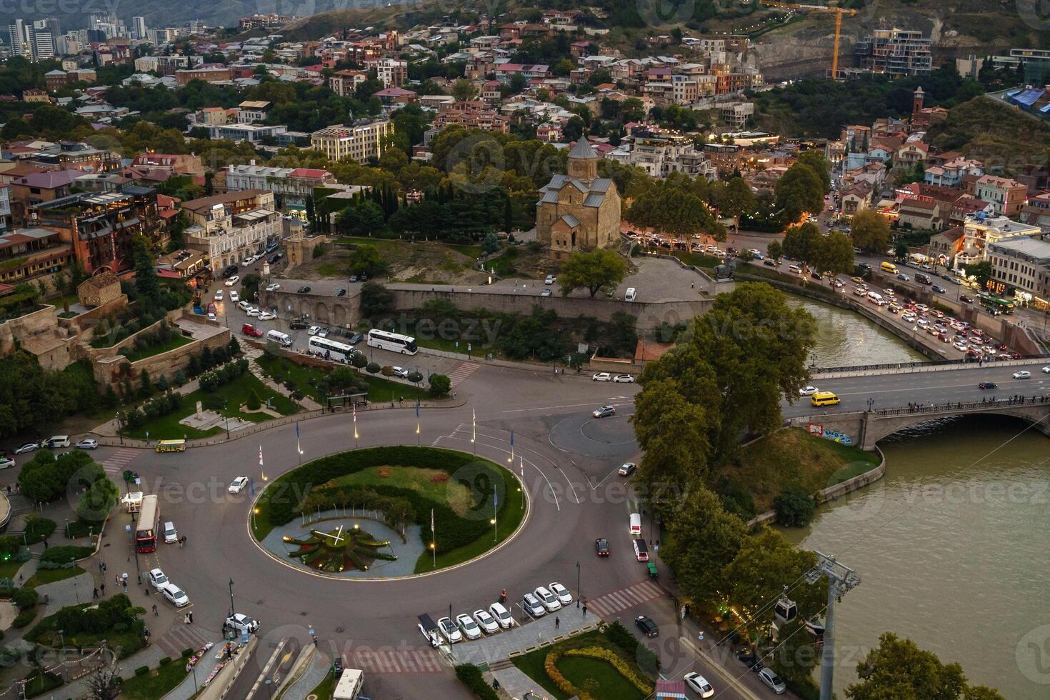 Aerial view of Tbilisi showcasing vibrant city life, ancient architecture, and riverside tranquility photo