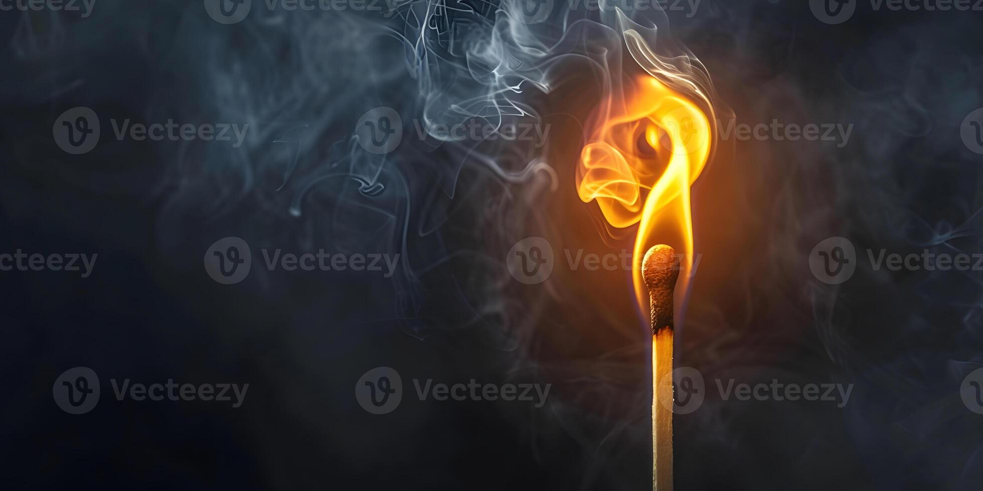 Close-up of a burning match photo