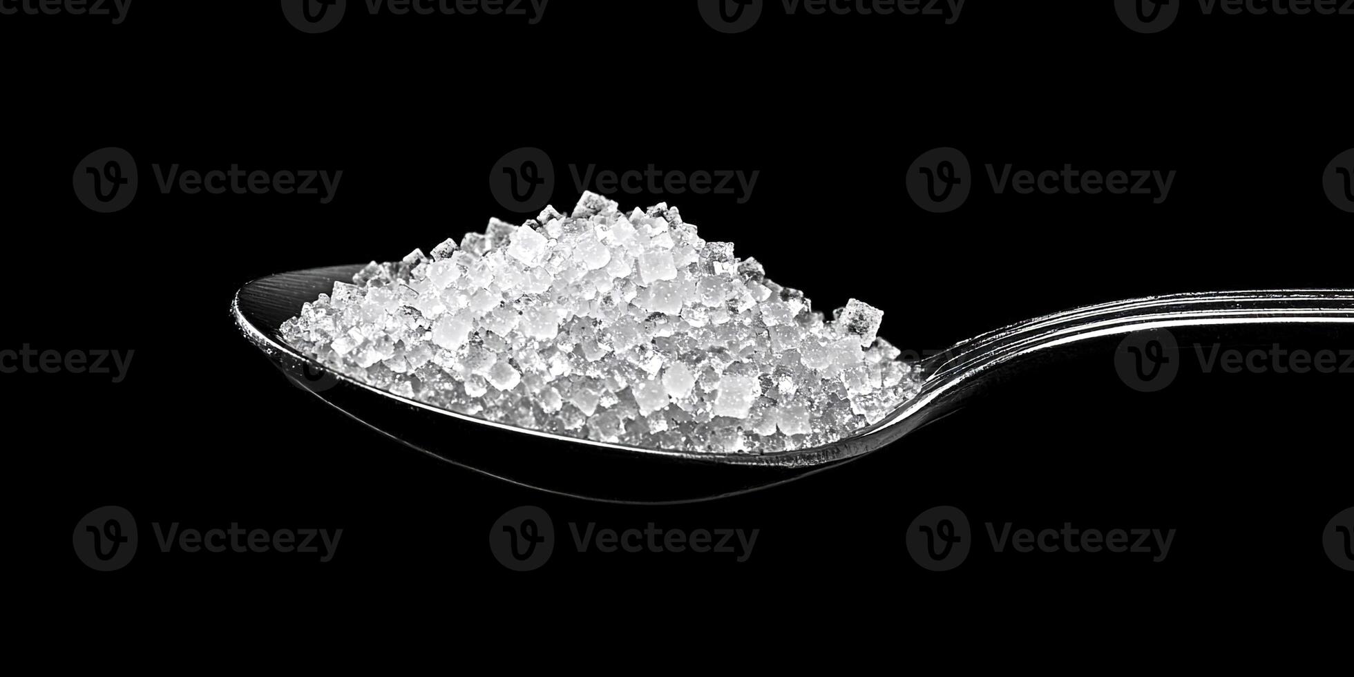Macro photo of sugar in a spoon