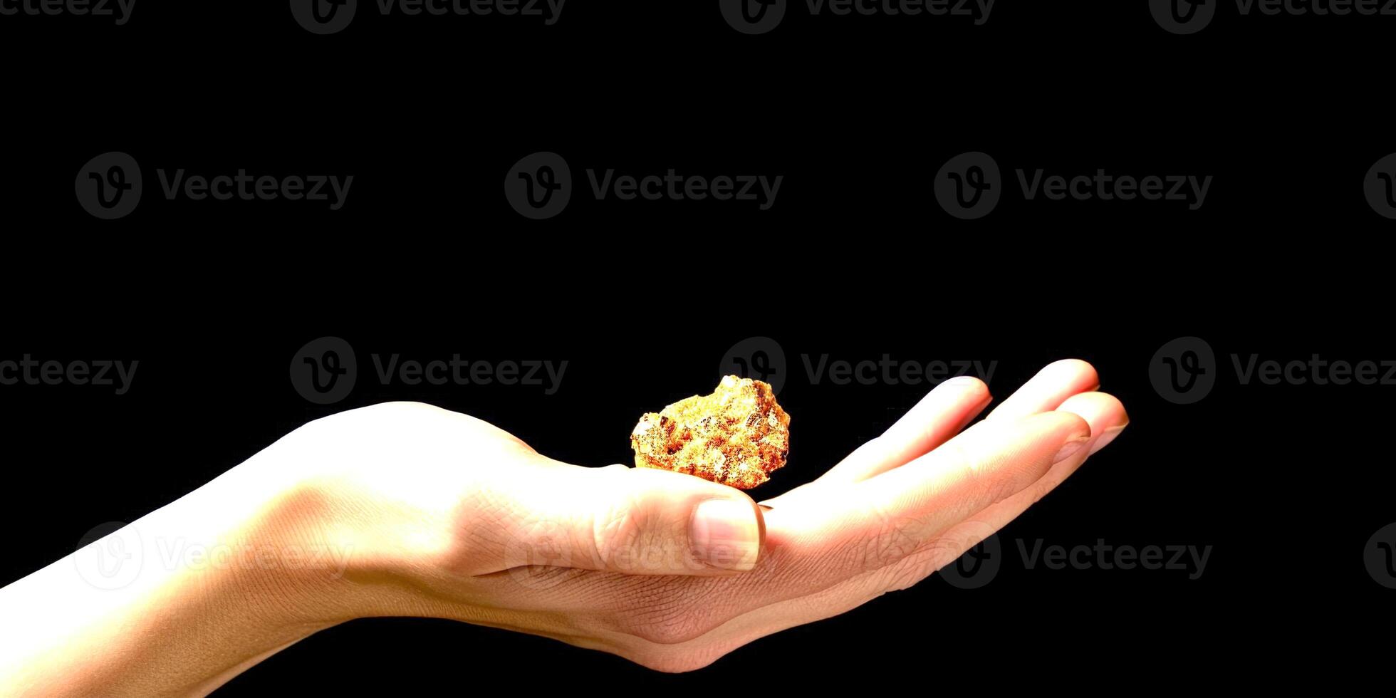 Natural gold in the hand photo