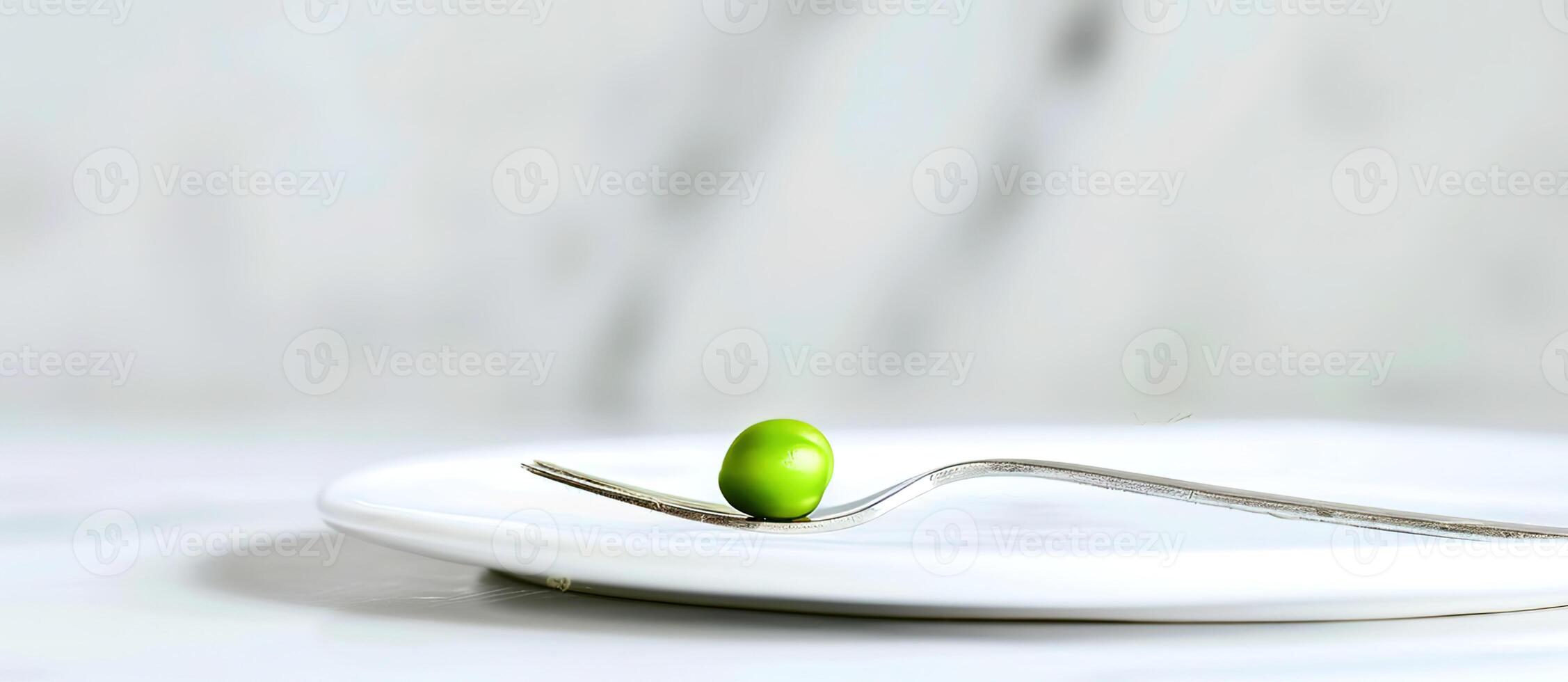 A small green bean on a fork photo