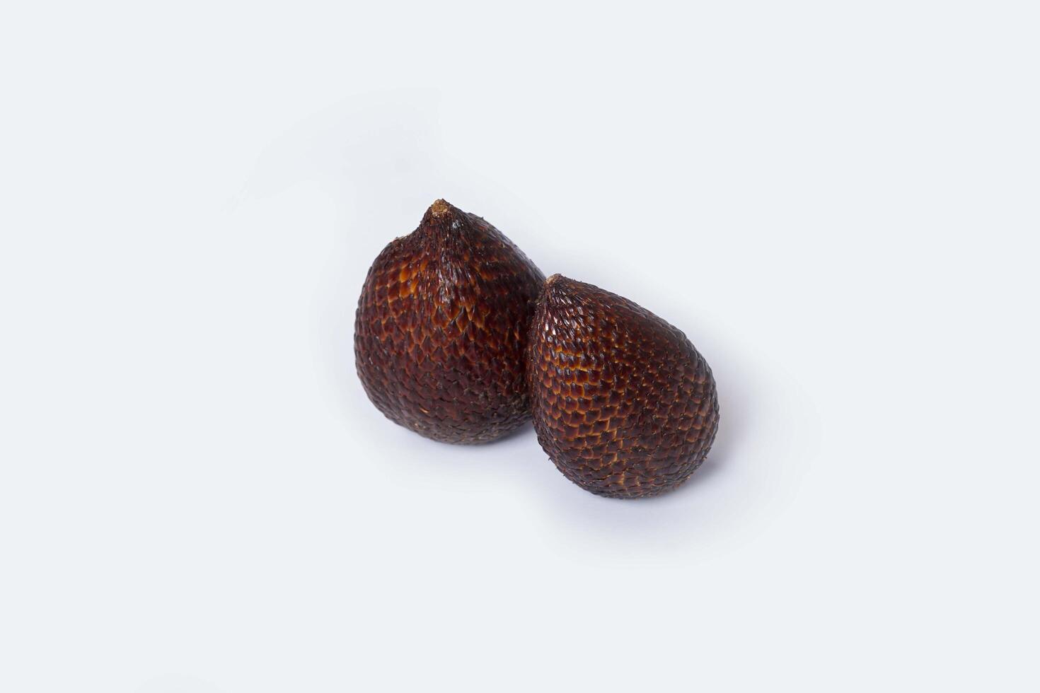 Assortment of exotic fruits isolated on white background. Close up of heap of fruit. Concept of healthy eating and dieting lifestyle. photo