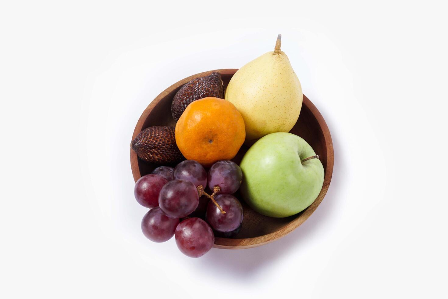 Assortment of exotic fruits isolated on white background. Close up of heap of fruit. Concept of healthy eating and dieting lifestyle. photo