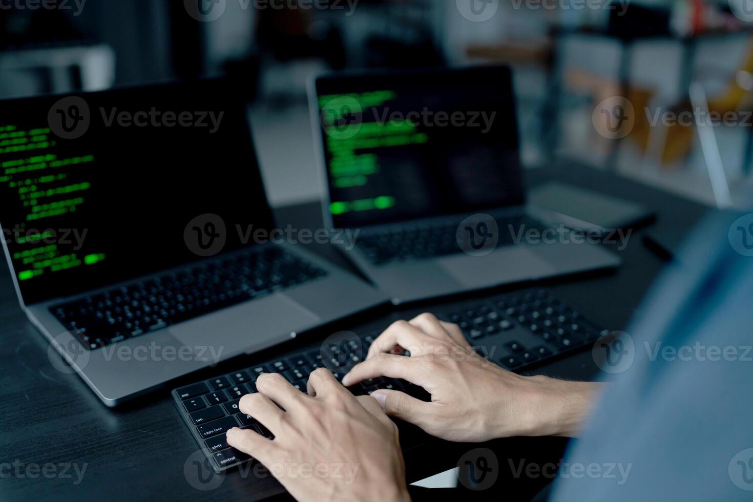 Asian man software engineer Working on Computer at office desk for writing program code IT Software Engineer finding errors tech support devops creating digital photo