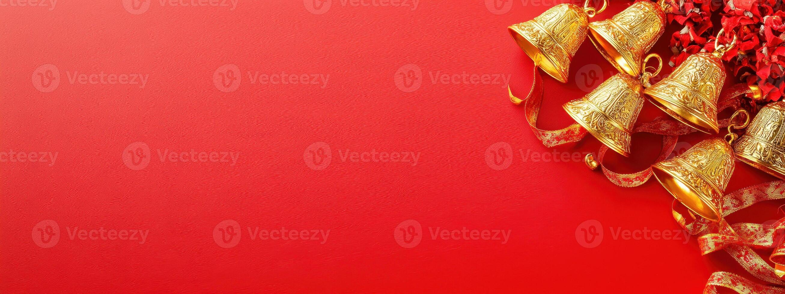 Christmas background with golden bells and red ribbon on red background with copy space. photo