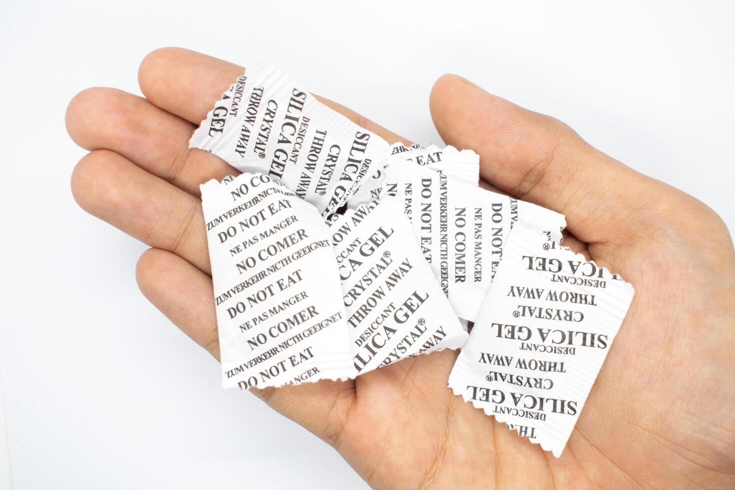 silica gel on a hand on a white background photo