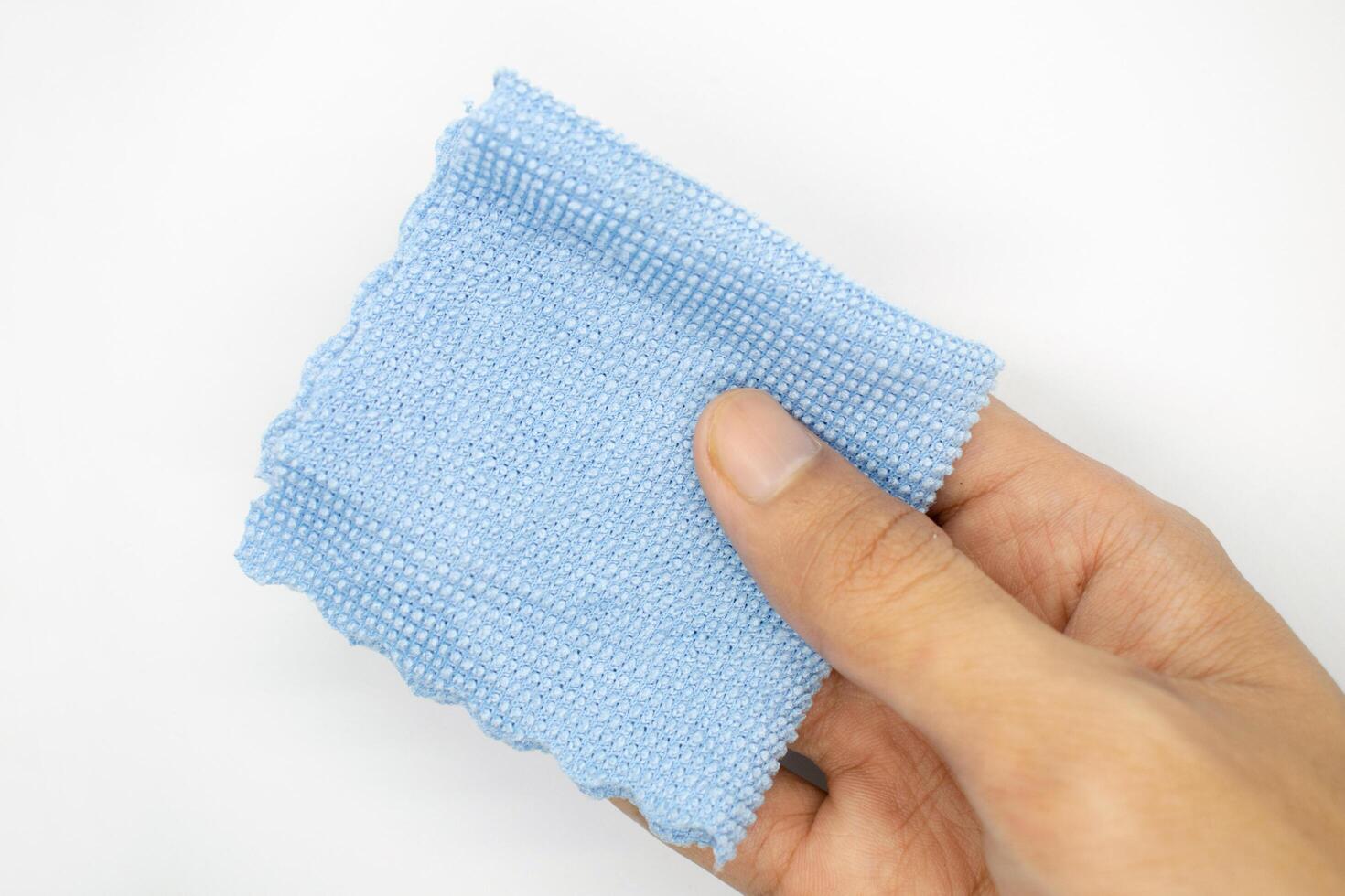 hand holding cleaning cloth isolated on white background photo