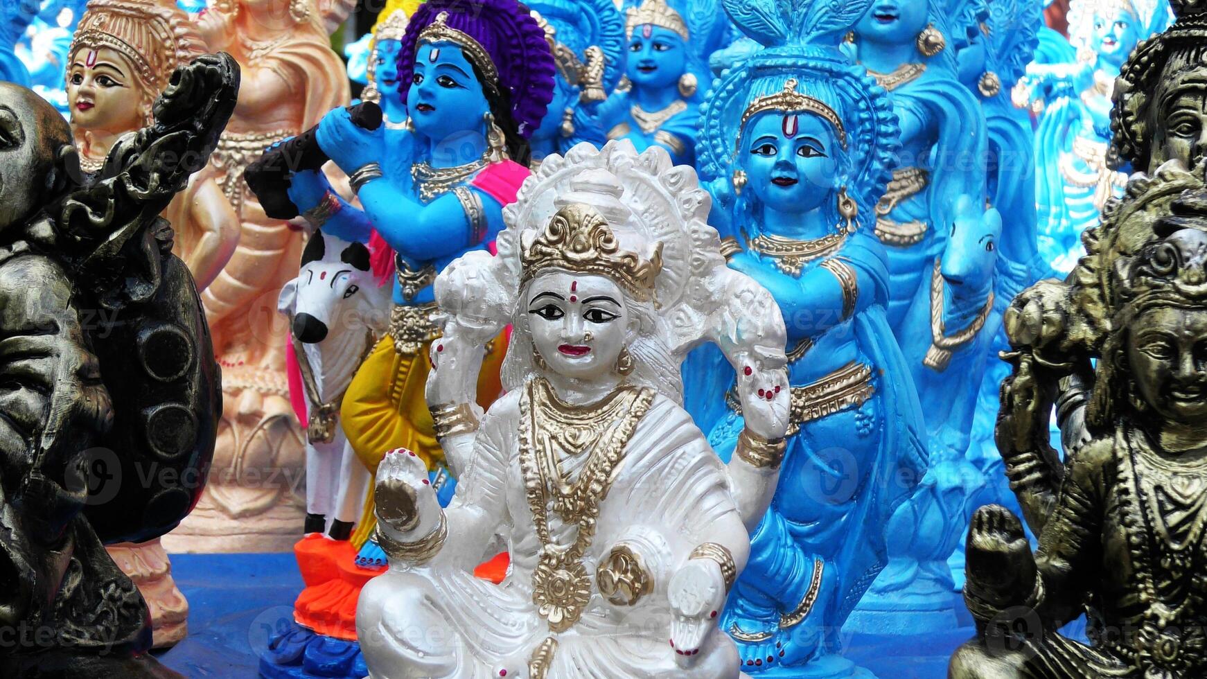 Colorful mythological sculptures displayed in a handicraft shop photo