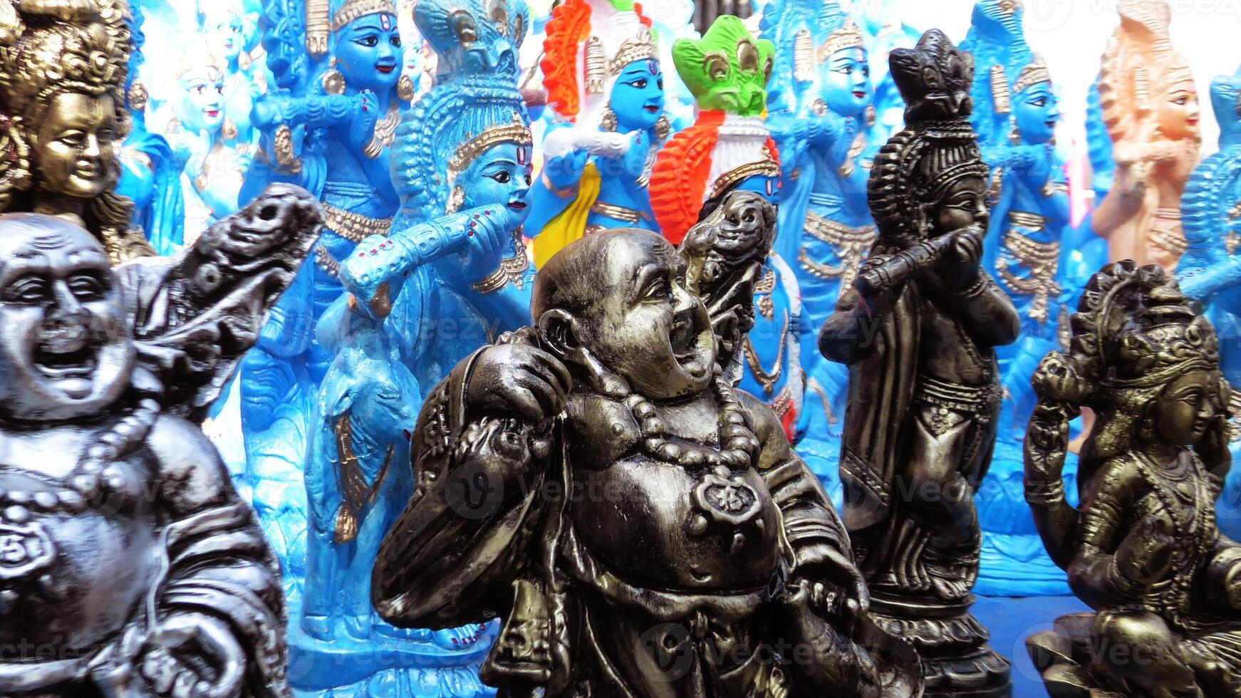 Colorful mythological sculptures displayed in a handicraft shop photo