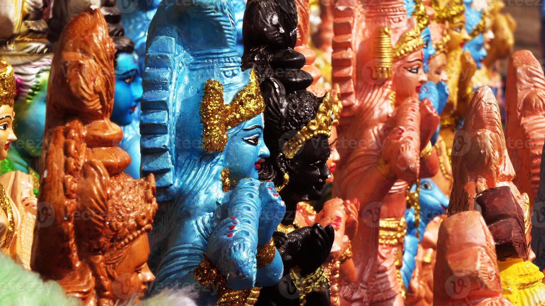 Colorful mythological sculptures displayed in a handicraft shop photo