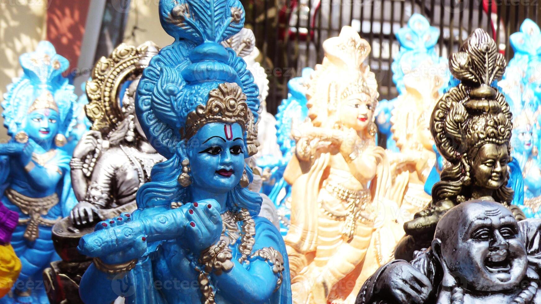 Colorful mythological sculptures displayed in a handicraft shop photo