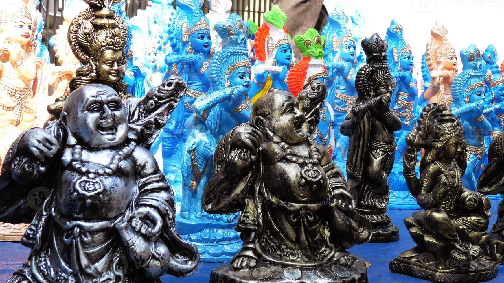 Colorful mythological sculptures displayed in a handicraft shop photo