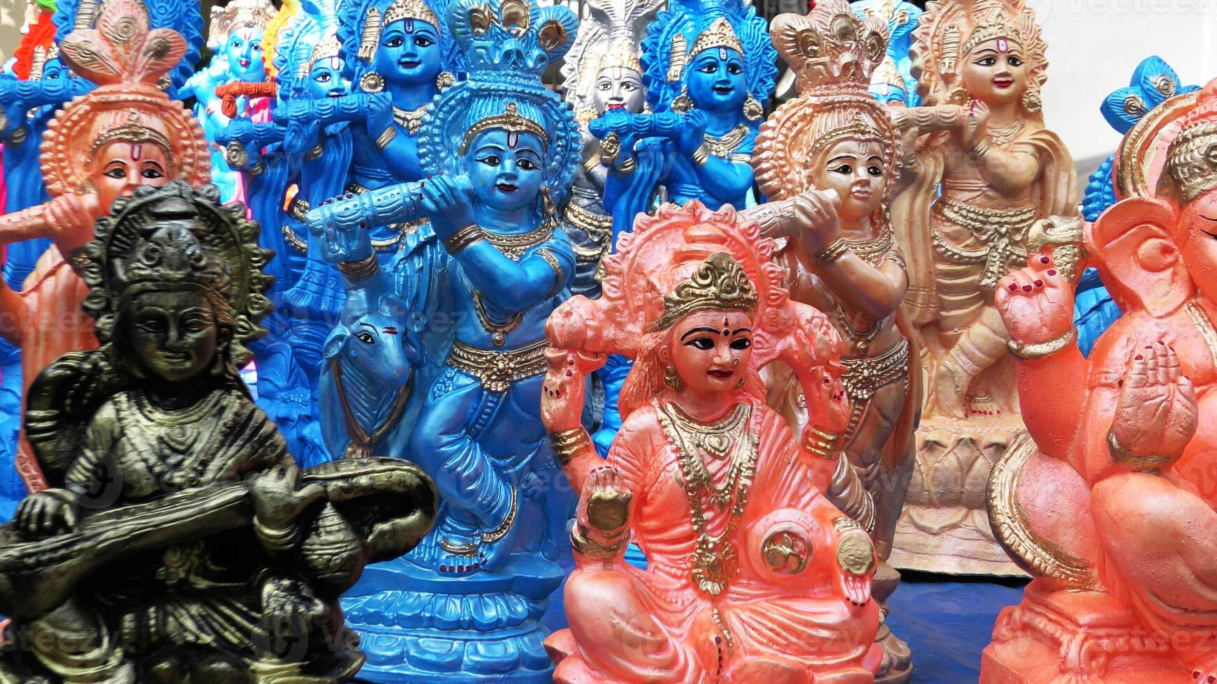 Colorful mythological sculptures displayed in a handicraft shop photo