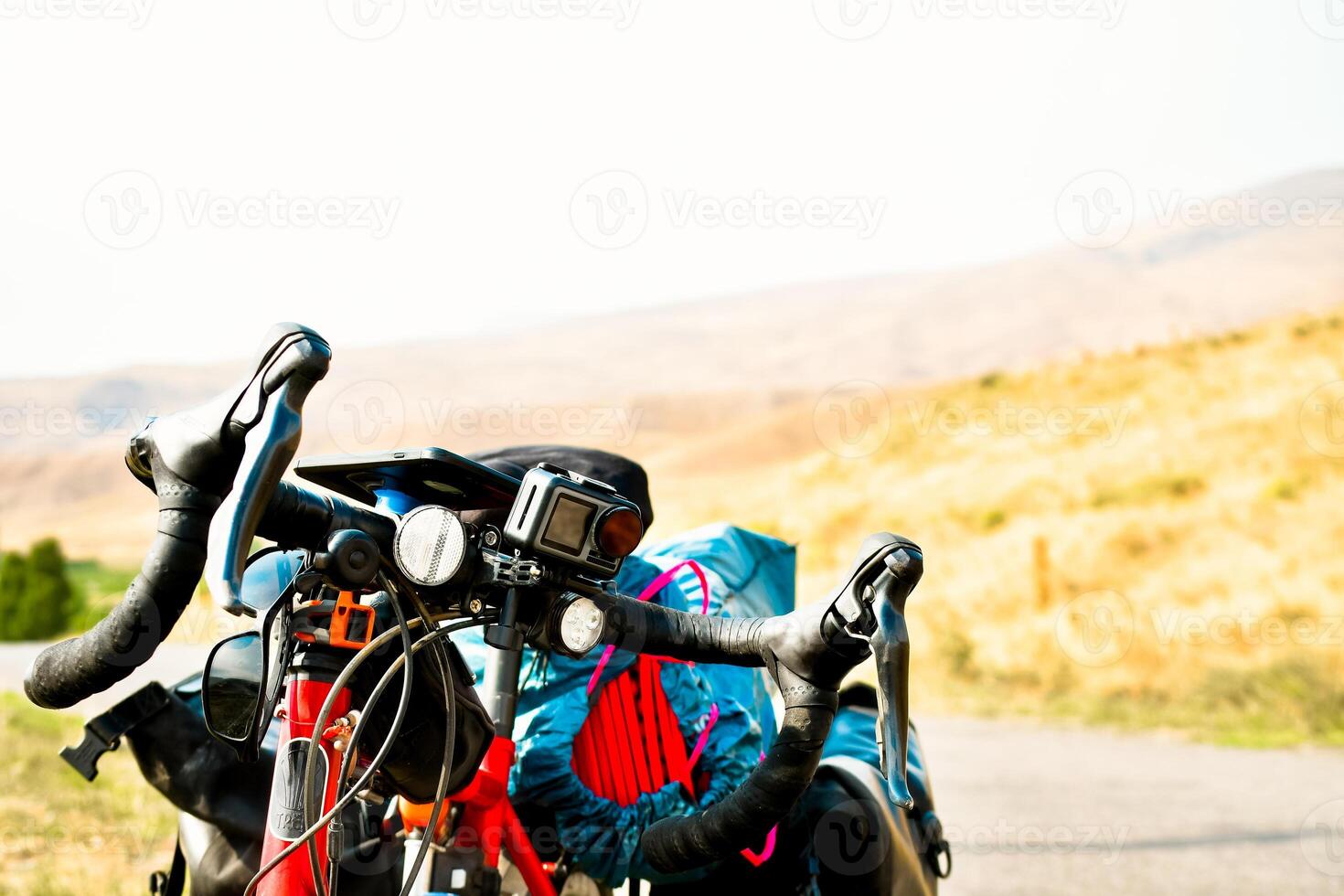 Background image of standing touring bicycle without cyclist on the road with nocars. Cycling in a countryside. Kazkbegi national park. Georgia.2020 photo