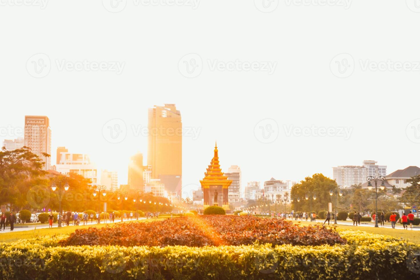 Phnom Penh ,Cambodia - 16th february, 2024 - people tourist in motion walk in streets by The Independence Monument in Phnom Penh. Statue of King Father Norodom Sihanouk photo