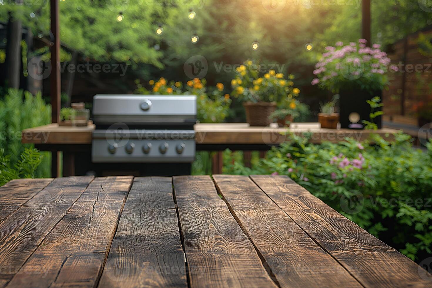 Rustic wooden table in a beautiful garden with a grill in the background photo