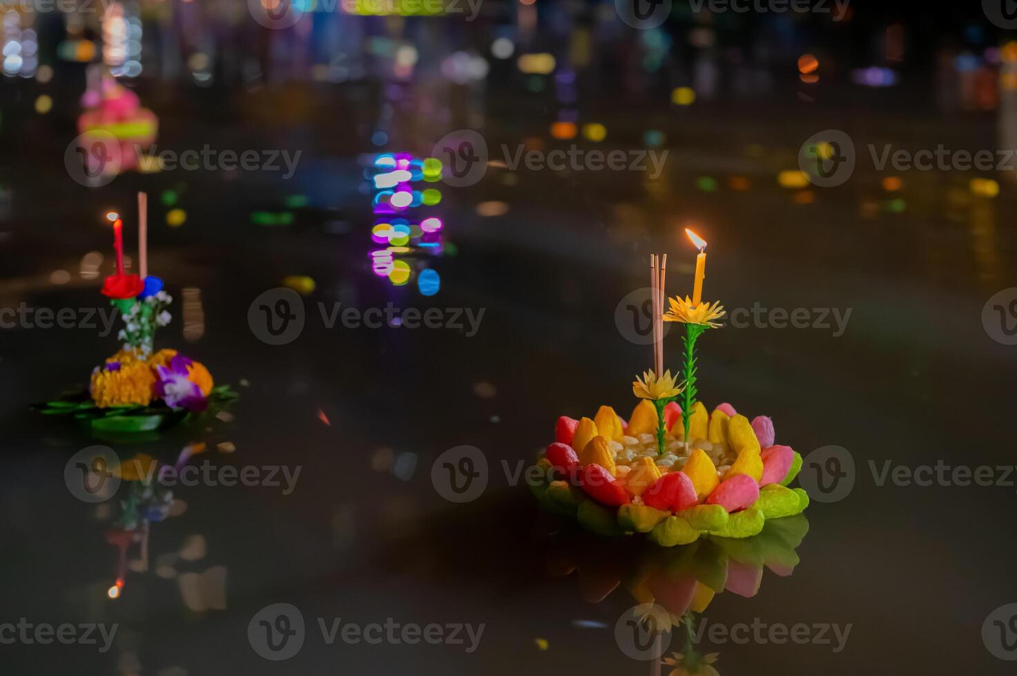 Krathong for Loy Krathong Festival in Thailand floating on dirty river that cause by people throw krathong on river. photo