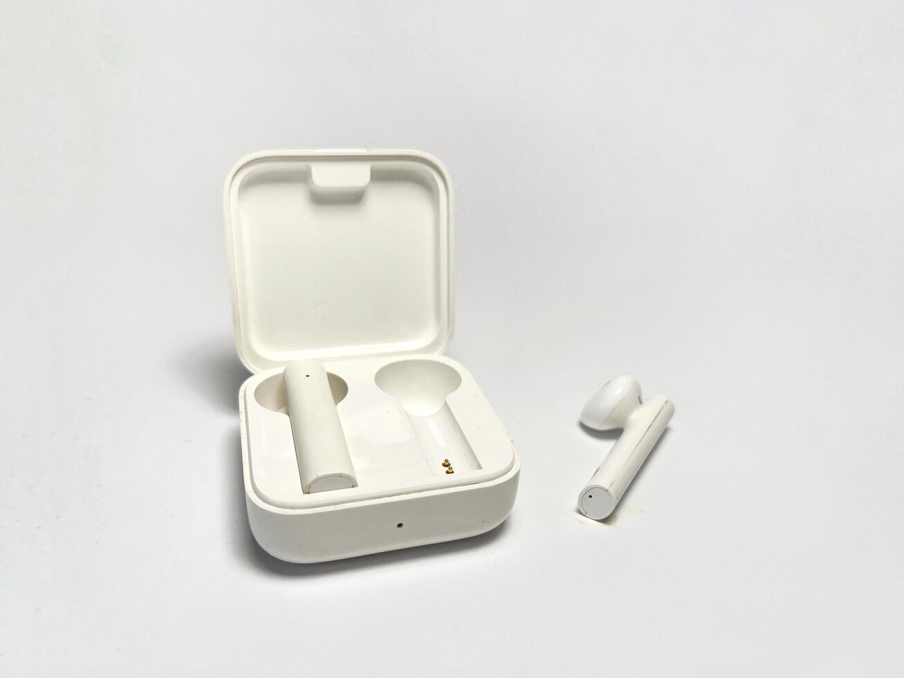 White earphones isolated on a white background with copy space for text photo